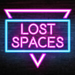 Text 'Lost Spaces' in a blue rectangle overlaying an inverted pink triangle