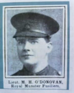 Photo of face of good-looking boyish young man wearing an army officer's cap.